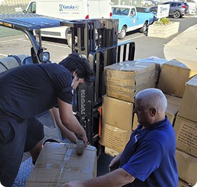 Boxes being loaded off of a forklift at an Oahu storage warehouse.