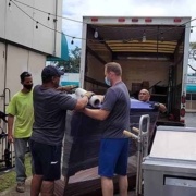 Honolulu courier and delivery service team loading an Oahu delivery truck.