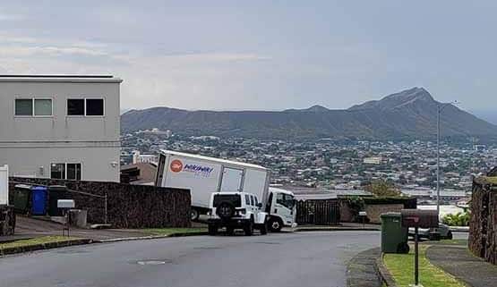 Hawaii cross-border shipping company, Wikiwiki Express Delivery, at an international shipping warehouse.