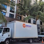 Oahu delivery truck parked outside of a business in Honolulu. Courier services, Hawaii.