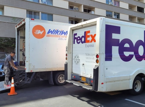 Oahu affordable courier service truck next a FedEx delivery truck. Oahu shipping services. Courier service near me.