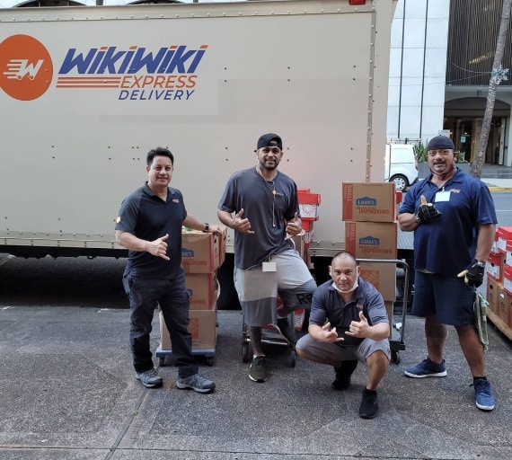 Honolulu courier service team pose for a company photo.
