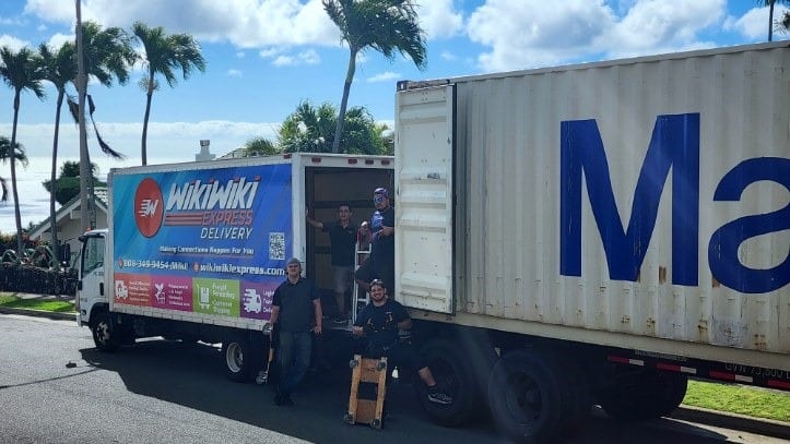 Oahu self-storage and moving company, Honolulu loading items into a shipping container.